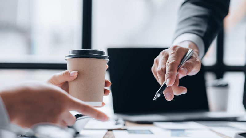 The sales department is having a monthly summary meeting to bring it to the department manager, they are verifying the correctness of the documents that are prepared before bringing in to the manager